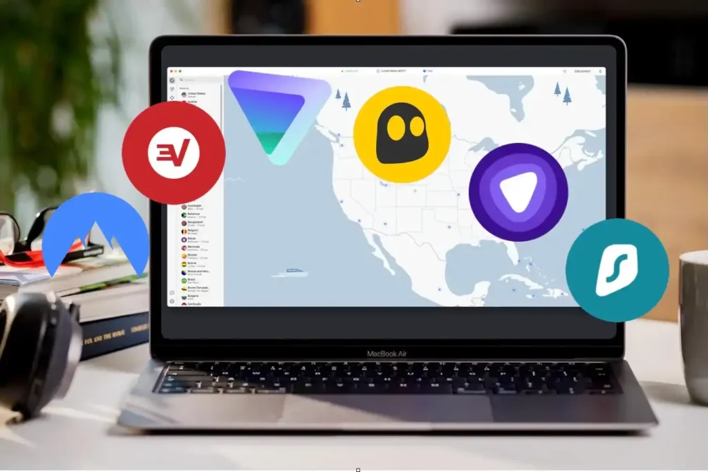 A MacBook Air on a desk displaying a VPN interface with a map of North America. Overlaying the screen are logos of popular VPN providers, including ExpressVPN, NordVPN, CyberGhost, Surfshark, and VyprVPN. The setup includes books, glasses, and a cozy workspace environment.